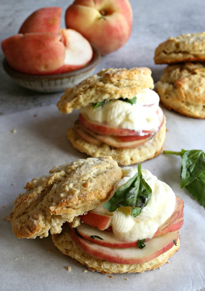 Individual peach shortcakes with sweet buttermilk biscuits and peaches in a honey basil syrup.