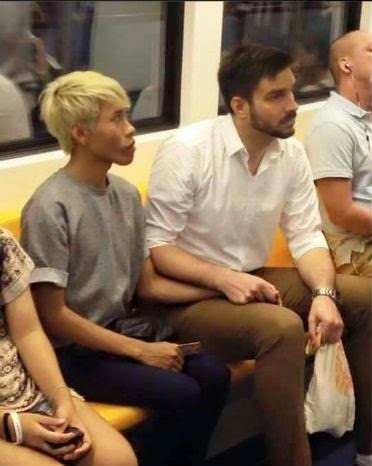 Thai-German gay couple holding hands