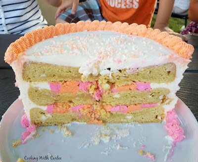 showing the inside of the cookie cake with layers of large cookies and frosting