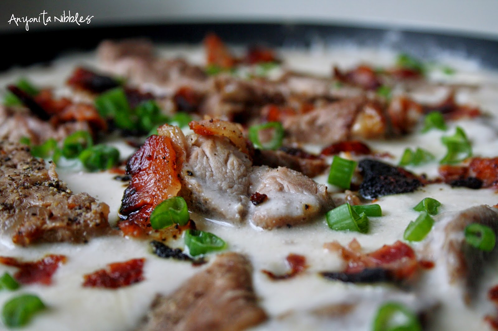 This skillet soup is made with pork cooked two ways, crispy bacon and loads of cream of mushroom soup.