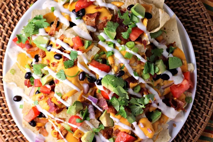 Chipotle Ranch Bacon Cheddar Nachos | by Renee's Kitchen Adventures - Easy recipe for a delicious appetizer or fun main dish the whole family will love!  Cheesy goodness with every bite! #SimmeredinTradition 