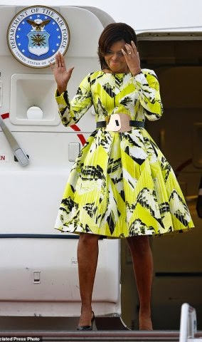 6X7JOF9FHHSK2 3000239 Big in Japan U S first lady Michelle Obama waves upon her arriva a 4 1426678555723 Michelle Obama stuns in floral Kenzo dress as she arrirves Japan