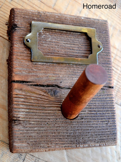 Distressed peg hooks to hang items in a farmhouse kitchen. 