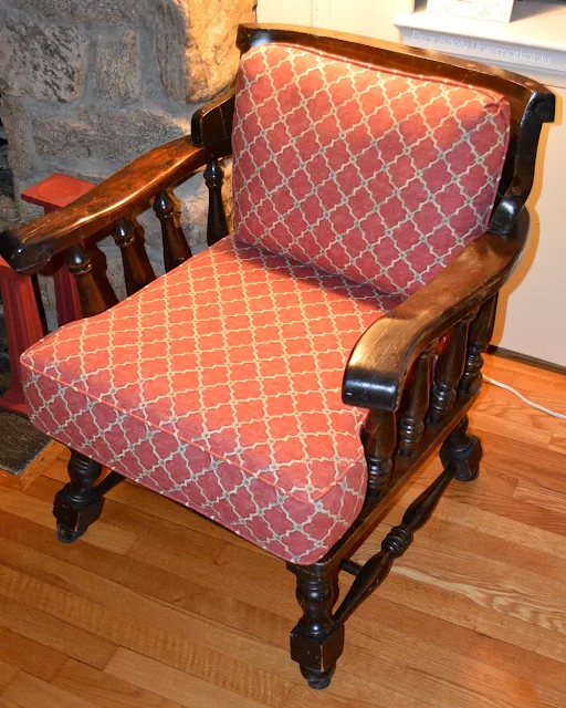 Wooden Captains Chair with red fabric on cushions