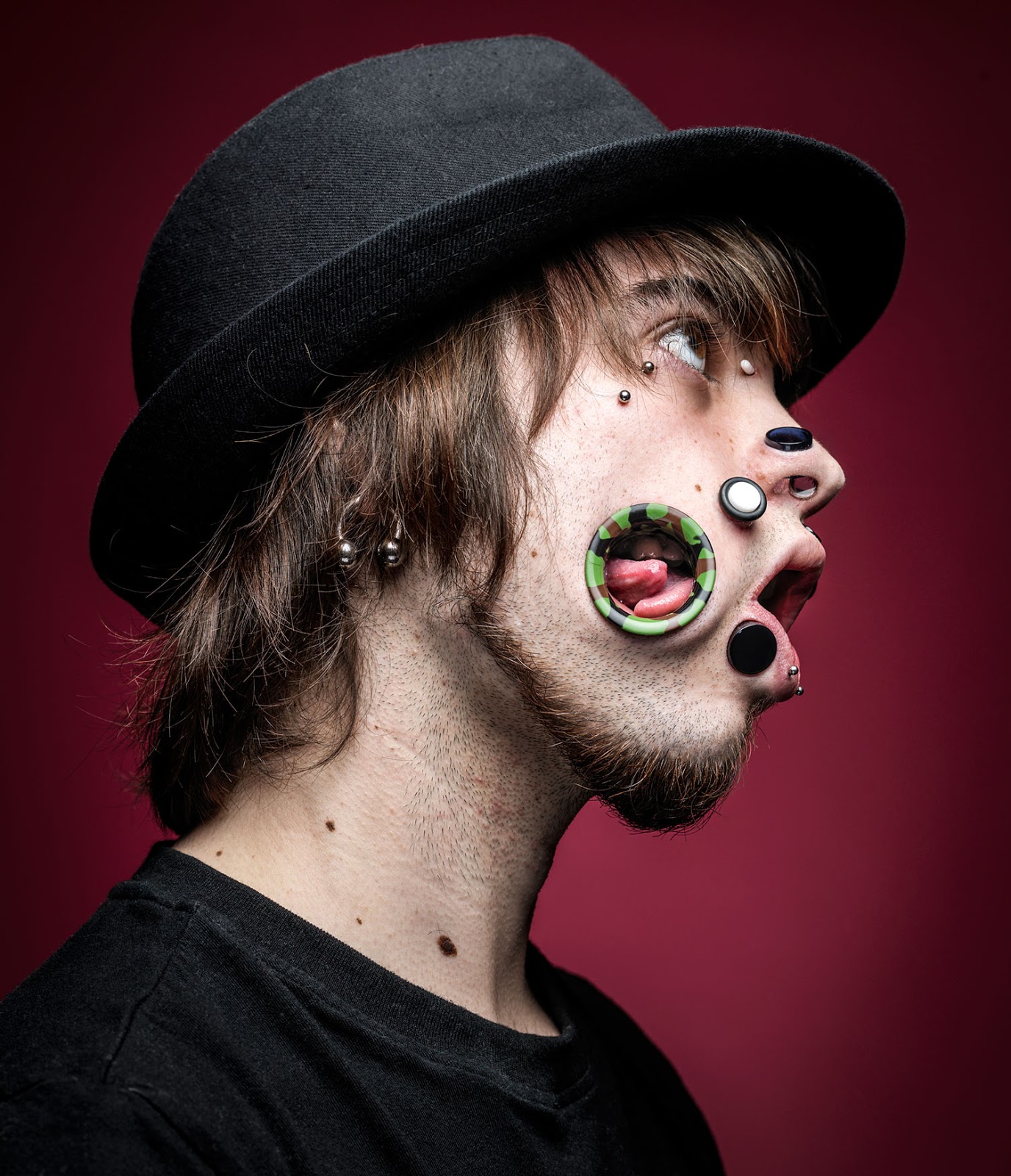 Exquisite Sapphire Flesh Tunnels on face.A new trend?