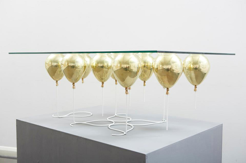 Glass coffee table with balloons as base