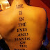 Life is in the eyes and hands of the beholder quote tattoo on full back 