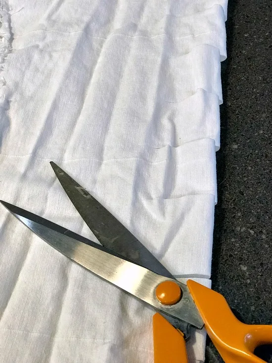 Scissors and white fabric