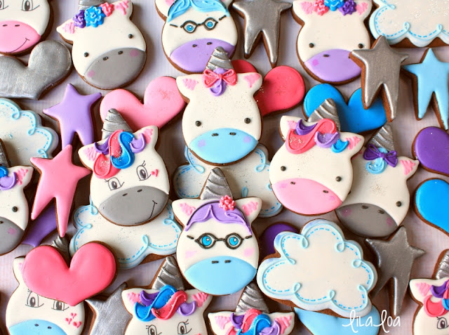 Decorated unicorn sugar cookies with stars and clouds