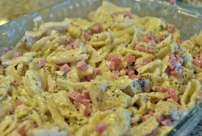 chicken cordon bleu casserole mixture in a pan