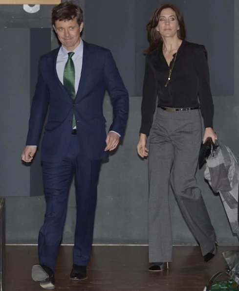 Crown Prince Frederik and Crown Princess Mary met with UN secretary Kofi Annan at Den Sorte Diamant, style wore trousers, satin top