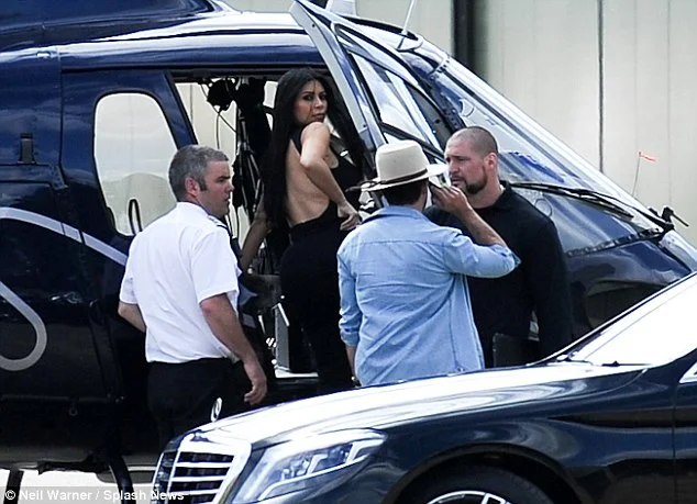 Kim Kardashian steps out braless in a semi sheer dress in London