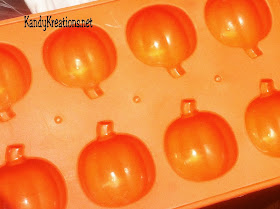 Celebrate Halloween with this sweet Pumpkin candy recipe.  These chocolate covered cherries are in the shape of pumpkins using a cheap dollar store mold and an easy candy recipe.  These chocolate candies are perfect for any fall holiday including Halloween and Thanksgiving, or just a more beautiful take on the store bough chocolate covered cherries.