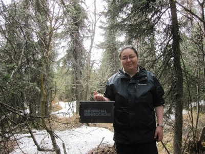 A picture of Anita Wirawan holding the Jody memorial cache.