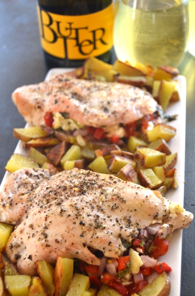 Greek Stuffed Chicken is loaded with feta cheese, tomatoes, red onion, spinach and bell peppers and marinaded in a delicious lemon dressing for the perfect meal! www.nutritionistreviews.com