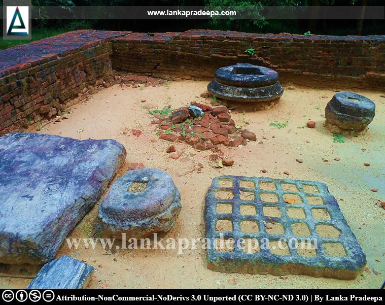 Yantra stone and other artifacts in the ruined image house, Owagiriya