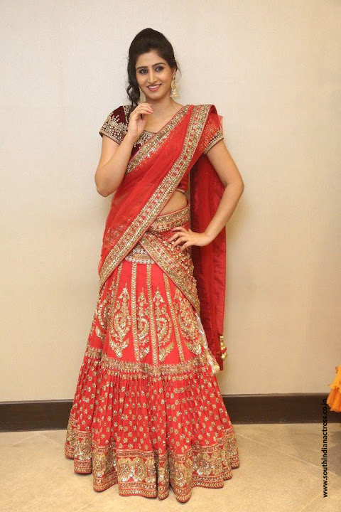 Varshini Sounderajan in red half saree