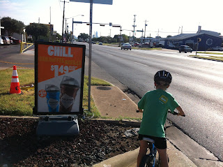 cycling on South Lamar with a child