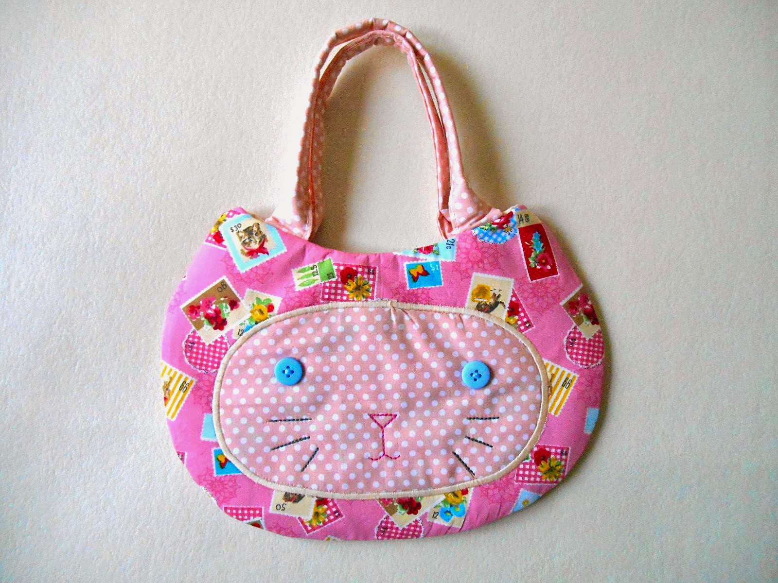 pink stamps cat face purse front