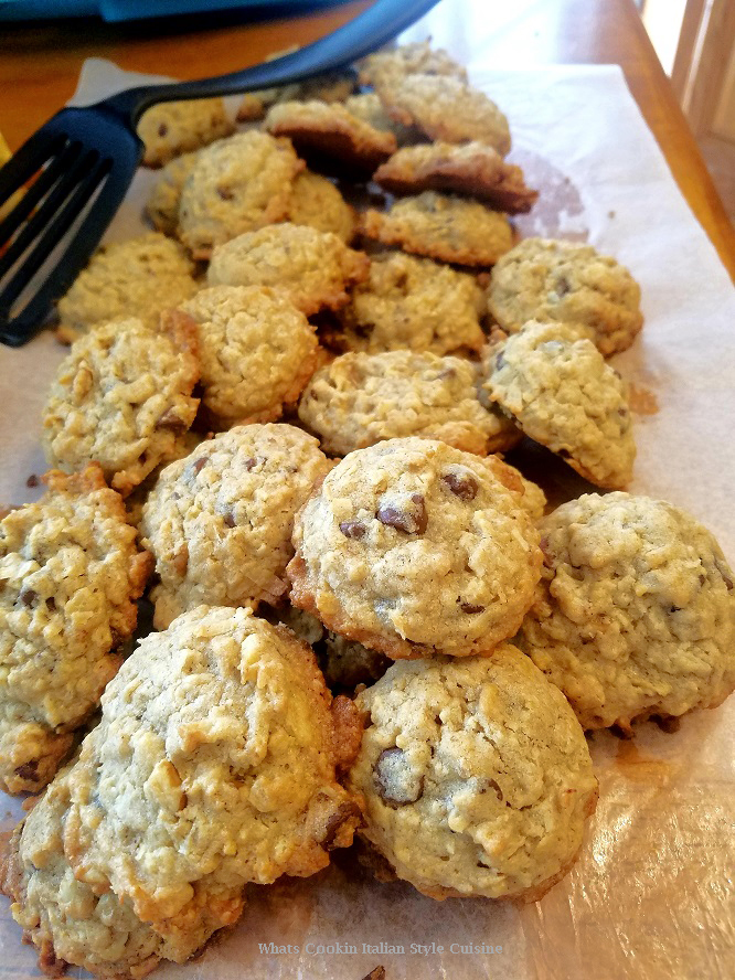 this is a whole batch of the cowboy cookies on parchment paper cooling. They won't stick together and they are chuck full of lots of delicious ingredients thats why they call them the everything cookies or cowboy cookies.