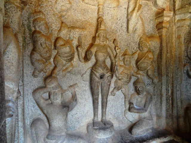 Ancient stone sculpture of standing Durga and maids - Pallava architecture Mahabalipuram
