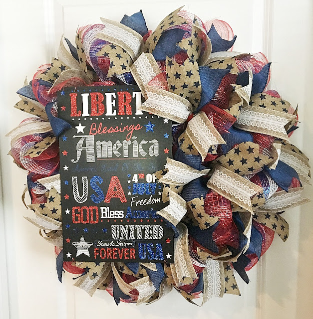 Vintage Paint and more... a patriotic wreath made with red white and blue deco mesh and lengths of beautiful wire edged ribbon featuring a chalkboard patriotic sign