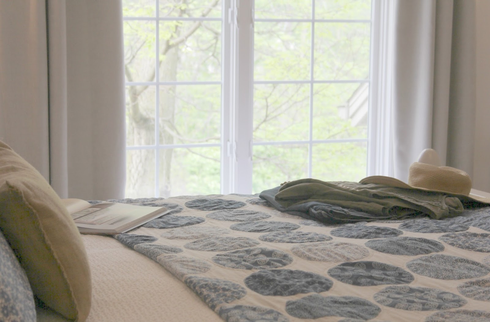 Beautiful blue moon quilt in bedroom with romantic country decor by Hello Lovely Studio