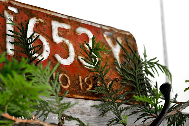 Red rusty license plate for Christmas inspiration via Funky Junk Interiors
