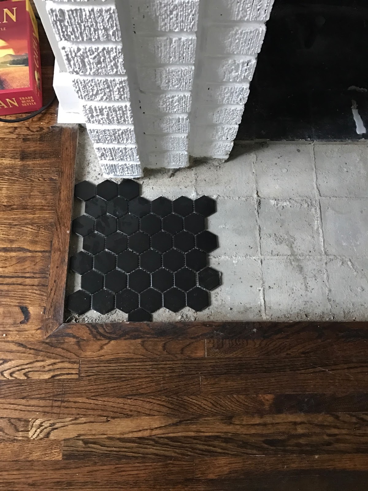 Always Rooney A Diy Fireplace Makeover With Hexagon Tile Up The Dust Over Every Inch Of Our Living Room Dining And Kitchen Fun Part Arrived I Cut Cement Board To Fill E On Fireplace