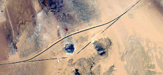 UFO drawing in the sand,imaginary roads,Abstract Naturalism,abstract photography deserts of Africa from the air,abstract surrealism,mirage in Sahara desert,fantasy forms of sand in the desert, UFO drawing in the sand,imaginary roads,Abstract Naturalism,abstract photography deserts of Africa from the air,