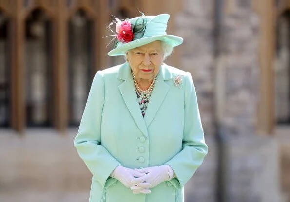 Queen Elizabeth II conferred the Honour of Knighthood on Captain Tom Moore at an Investiture at Windsor Castle in Windsor. turquoise coat