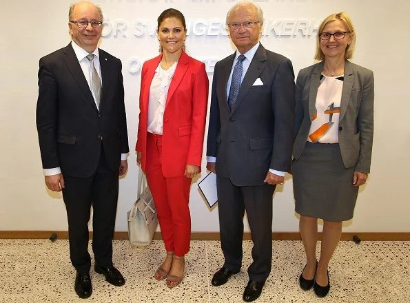 During her visit to the National Defence Radio Establishment, Crown Princess Victoria of Sweden wore a red jacket and trousers by Lexington Company