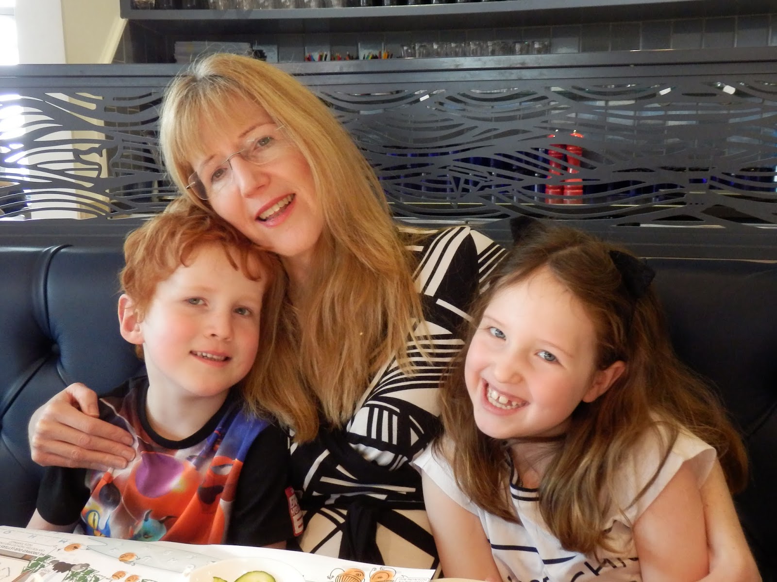 parenting during the summer holidays: Linda Hobbis with Caitlin and Ieuan at Pizza Express, Cardiff Bay