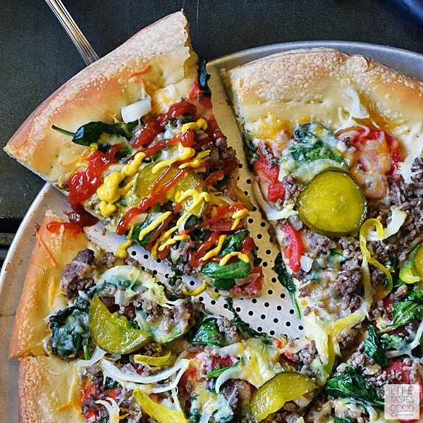 Cheeseburger Pizza Recipe | by Life Tastes Good takes everything I love about a big, juicy cheeseburger and plops it on top of a thick, delicious pizza crust for a tasty game day treat or a quick and easy dinner the whole family will love! #LTGrecipes #SundaySupper