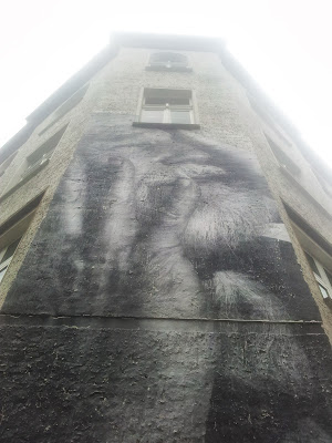 A Wall of Sorrow near Rosa Luxembourg Platz in Berlin by street artist JR