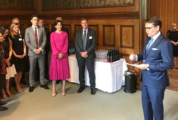 Crown Princess Mary wore No 21 long sleeve pleated midi dress, and carries Carlend Copenhagen Vanessa red clutch