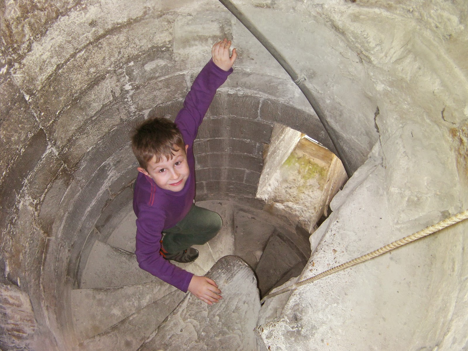 medieval spiral staircase in tower of romsey abbey boy in stone spiral staircase romsey hampshire
