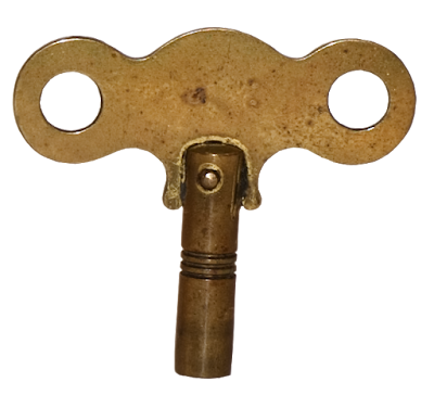 A large brass key for winding antique clocks.