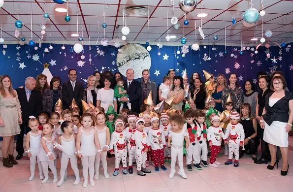 Princess Charlene wore Louis Vuitton wool coat. Rosine Sanmori Nursery / Day Care Centre in Fontvieille. Christmas gifts