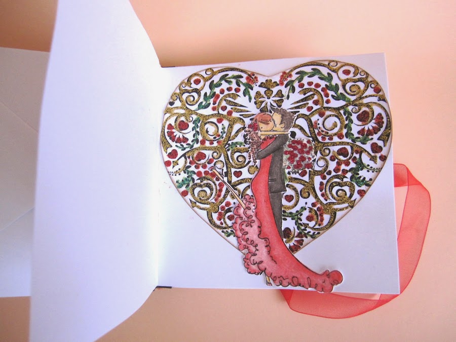 paso 12 tutorial mini-álbum scrapbook, cómo pegar la tarjeta de felicitación para que haga de portada trasera con cinta de raso para cerrar con lazo