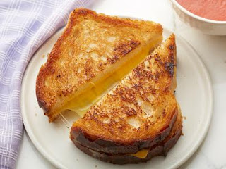 Grilled cheese sandwhich on a white plate
