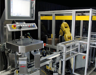 Robotic case erector and loader from ESS Technologies with integrated track and trace system.