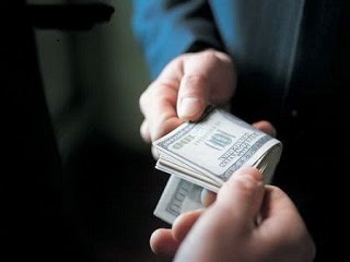 A picture of a bribe offered to an government official.