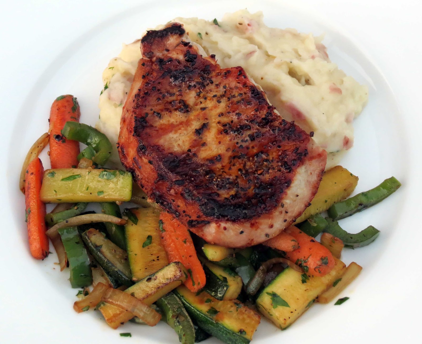 Dinner with the Welches Grilled Pork Chops with Sautéed Veggies over