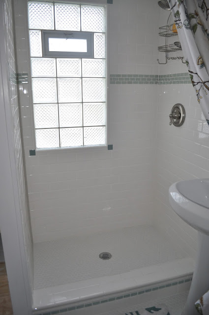 bathroom, reno, subway tile, sea glass tile, glass tile, white grout, grout, glass block window, hex tile