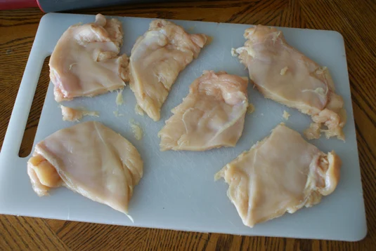 Cut chicken into smaller pieces and season