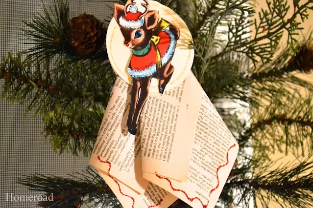 Holiday recycled book ornament on a tree