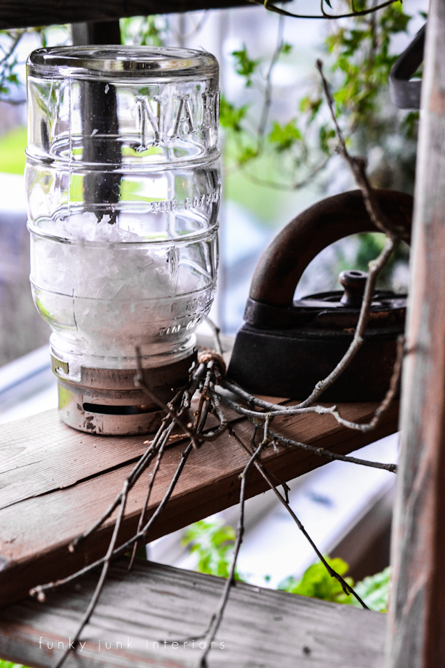 Vintage Nabob mason jar filled with snow, on a plant ladders stand, via Funky Junk Interiors