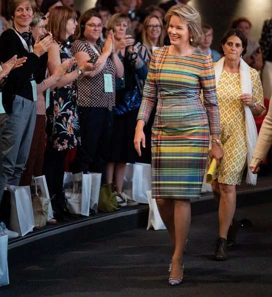 Queen Mathilde wore a plaid madras sheath dress by Dries Van Noten. The National Board of Child Welfare (Oeuvre Nationale de l'Enfance)