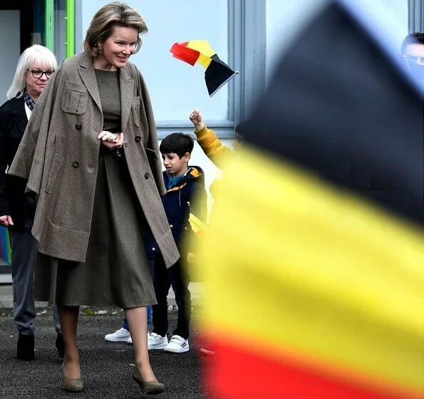 Queen Mathilde visited the 'Fly to the Moon' project of Maison des Ateliers Mons. Natan dress and Armani wool coat